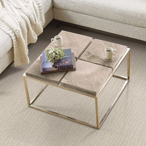 Coffee table with marble tabletop and cozy living room decor at Maximum Carpets & Flooring in Lynbrook, New York